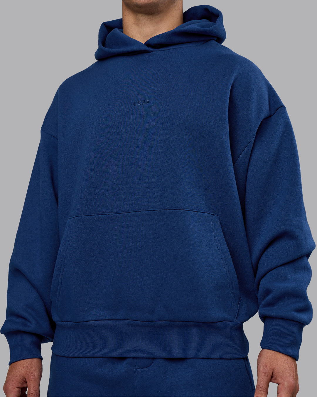 Man wearing MVP Oversized Hoodie - Midnight Blue | Model:Jaiden | Size:M