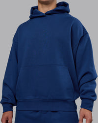 Man wearing MVP Oversized Hoodie - Midnight Blue | Model:Jaiden | Size:M