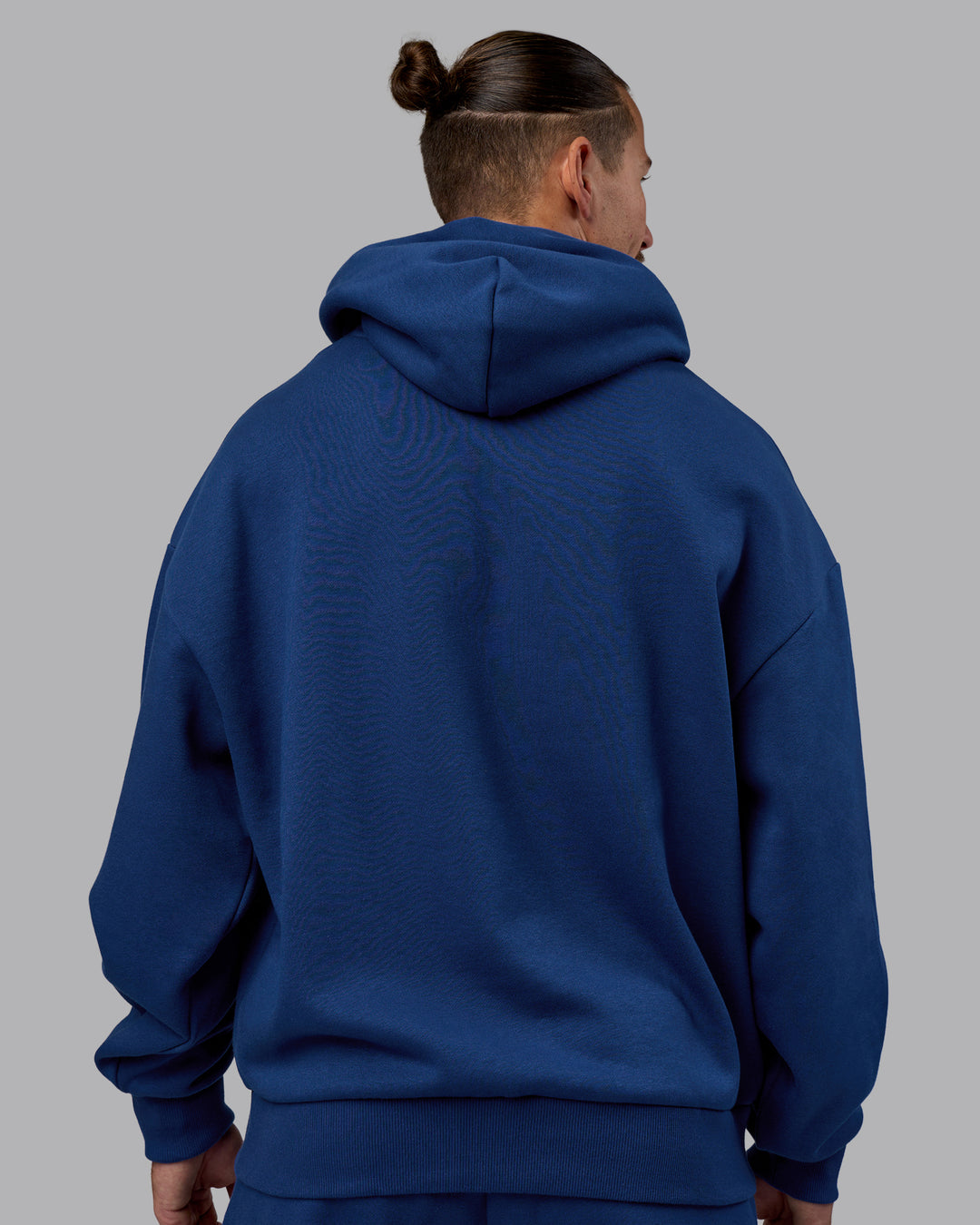 Man wearing MVP Oversized Hoodie - Midnight Blue | Model:Jaiden | Size:M