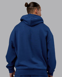Man wearing MVP Oversized Hoodie - Midnight Blue | Model:Jaiden | Size:M