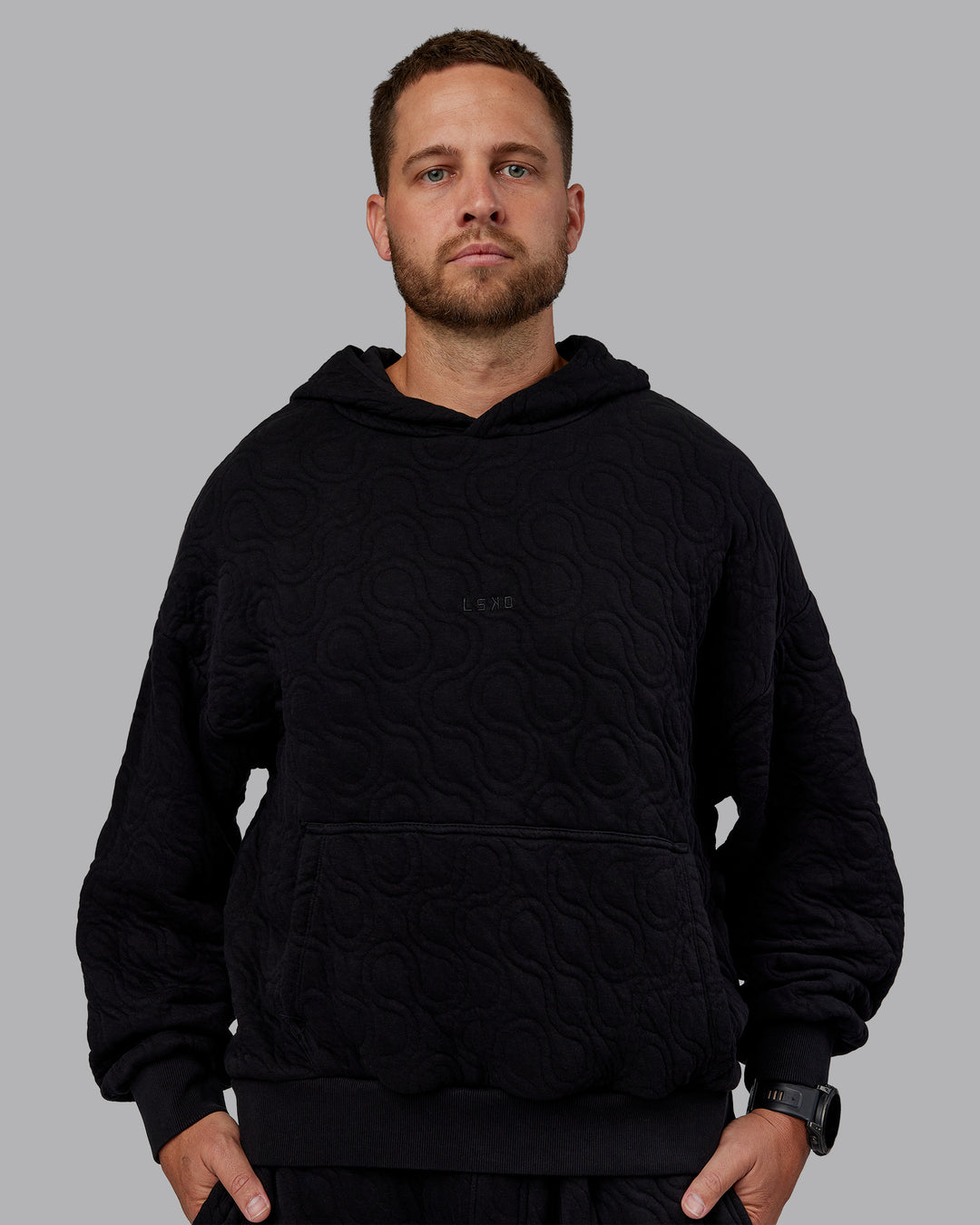 Man wearing MVP Quilted Oversized Hoodie - Black-Geometric | Model:Macca | Size:M
