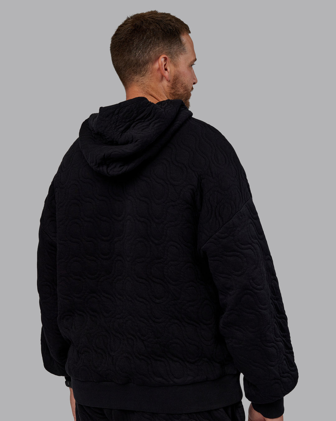 Man wearing MVP Quilted Oversized Hoodie - Black-Geometric | Model:Macca | Size:M