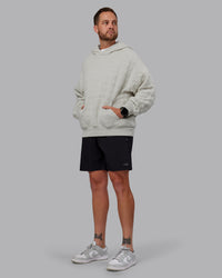 Man wearing MVP Quilted Oversized Hoodie in Digital Mist-Geometric | Model:Macca | Size:M