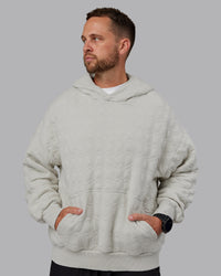 Man wearing MVP Quilted Oversized Hoodie in Digital Mist-Geometric | Model:Macca | Size:M