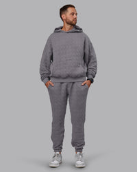 Man wearing MVP Quilted Oversized Hoodie - Storm Front-Geometric | Model:Macca | Size:M