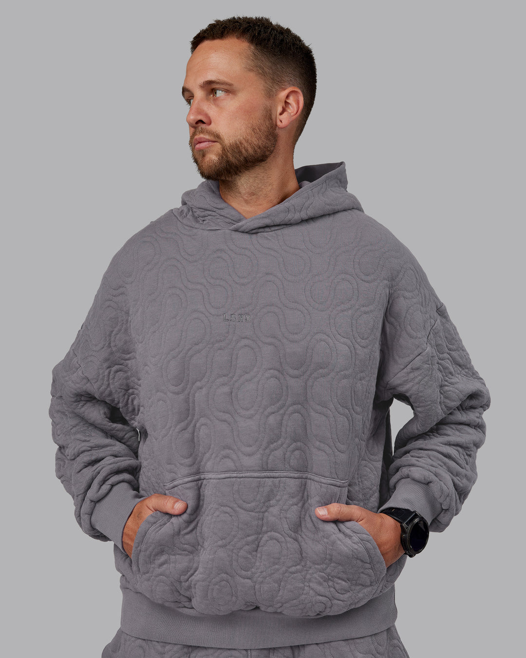 Man wearing MVP Quilted Oversized Hoodie - Storm Front-Geometric | Model:Macca | Size:M