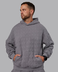 Man wearing MVP Quilted Oversized Hoodie - Storm Front-Geometric | Model:Macca | Size:M