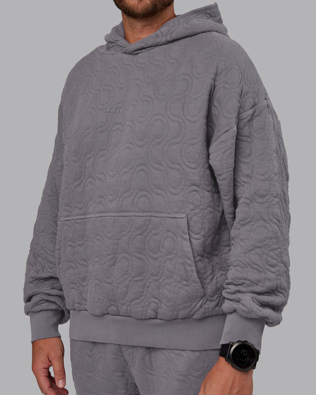 Man wearing MVP Quilted Oversized Hoodie - Storm Front-Geometric | Model:Macca | Size:M