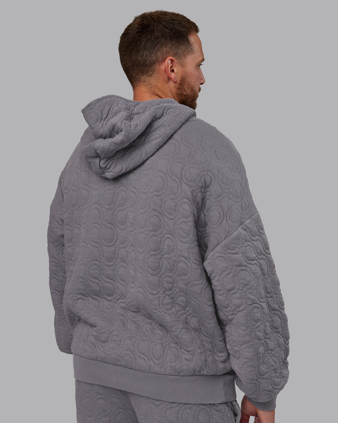 Man wearing MVP Quilted Oversized Hoodie - Storm Front-Geometric | Model:Macca | Size:M