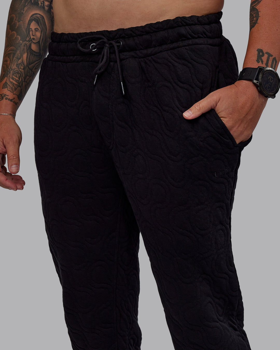 Man wearing MVP Quilted Track Pant - Black-Geometric | Model:Macca | SIze:M