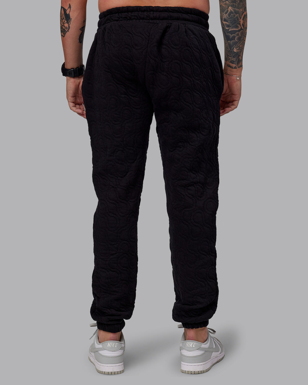 Man wearing MVP Quilted Track Pant - Black-Geometric | Model:Macca | SIze:M