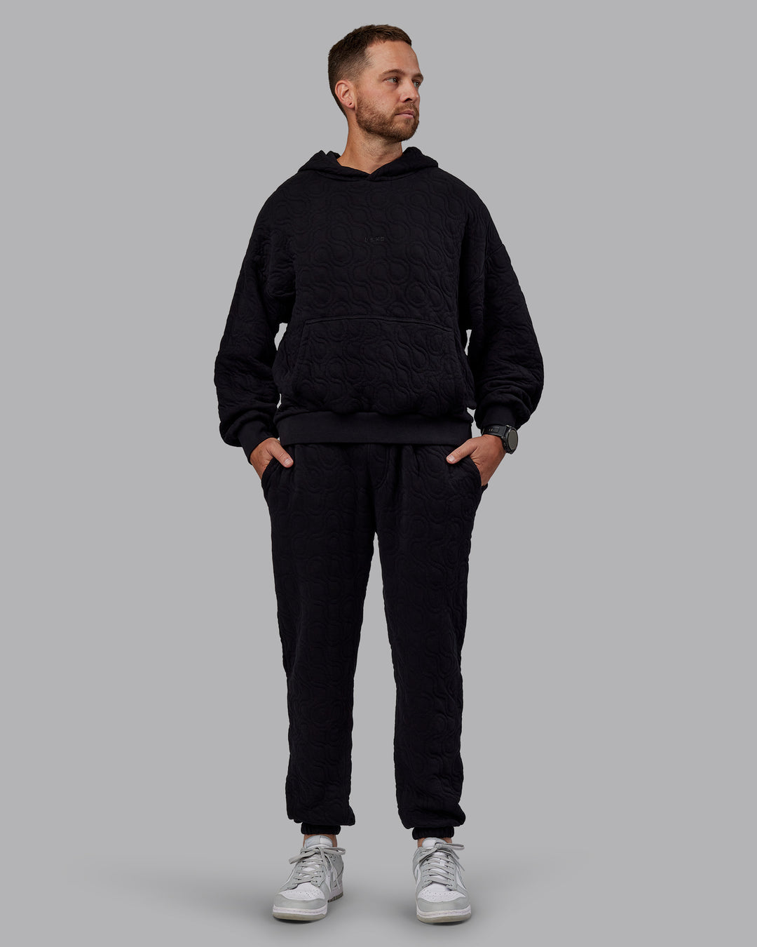 Man wearing MVP Quilted Track Pant - Black-Geometric | Model:Macca | SIze:M