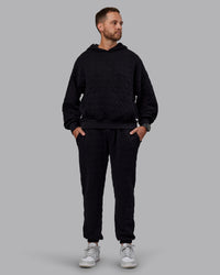 Man wearing MVP Quilted Track Pant - Black-Geometric | Model:Macca | SIze:M