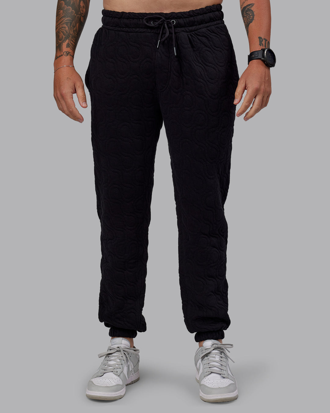 Man wearing MVP Quilted Track Pant - Black-Geometric | Model:Macca | SIze:M