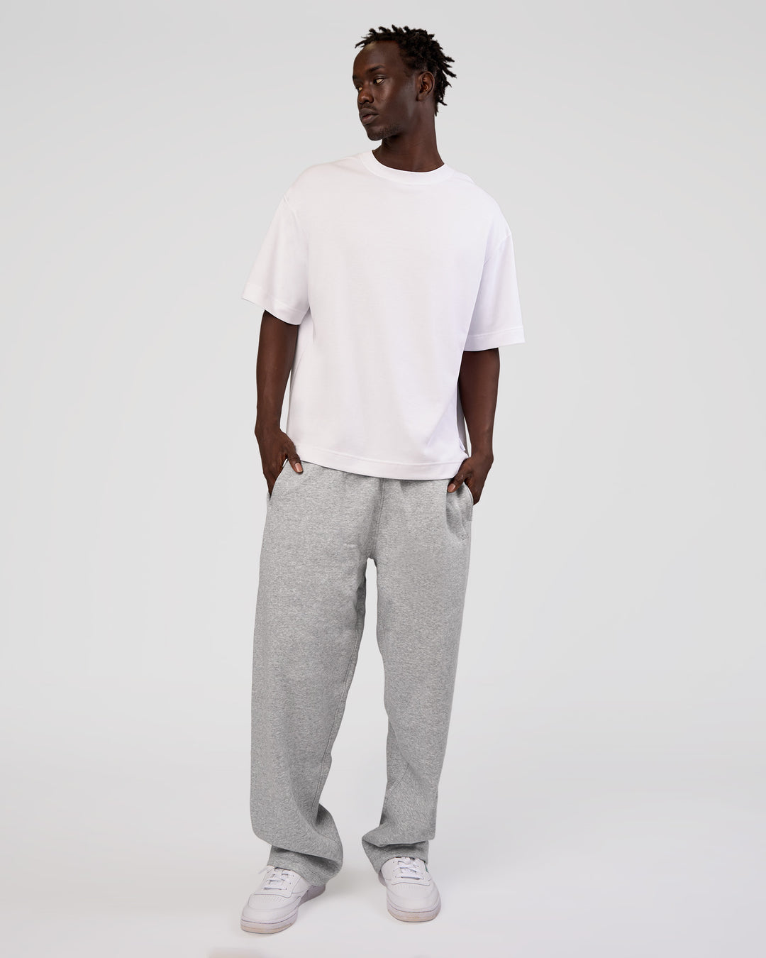 Man wearing MVP Straight Leg Pant - Light Grey Marl | Model:Okello | Size:M