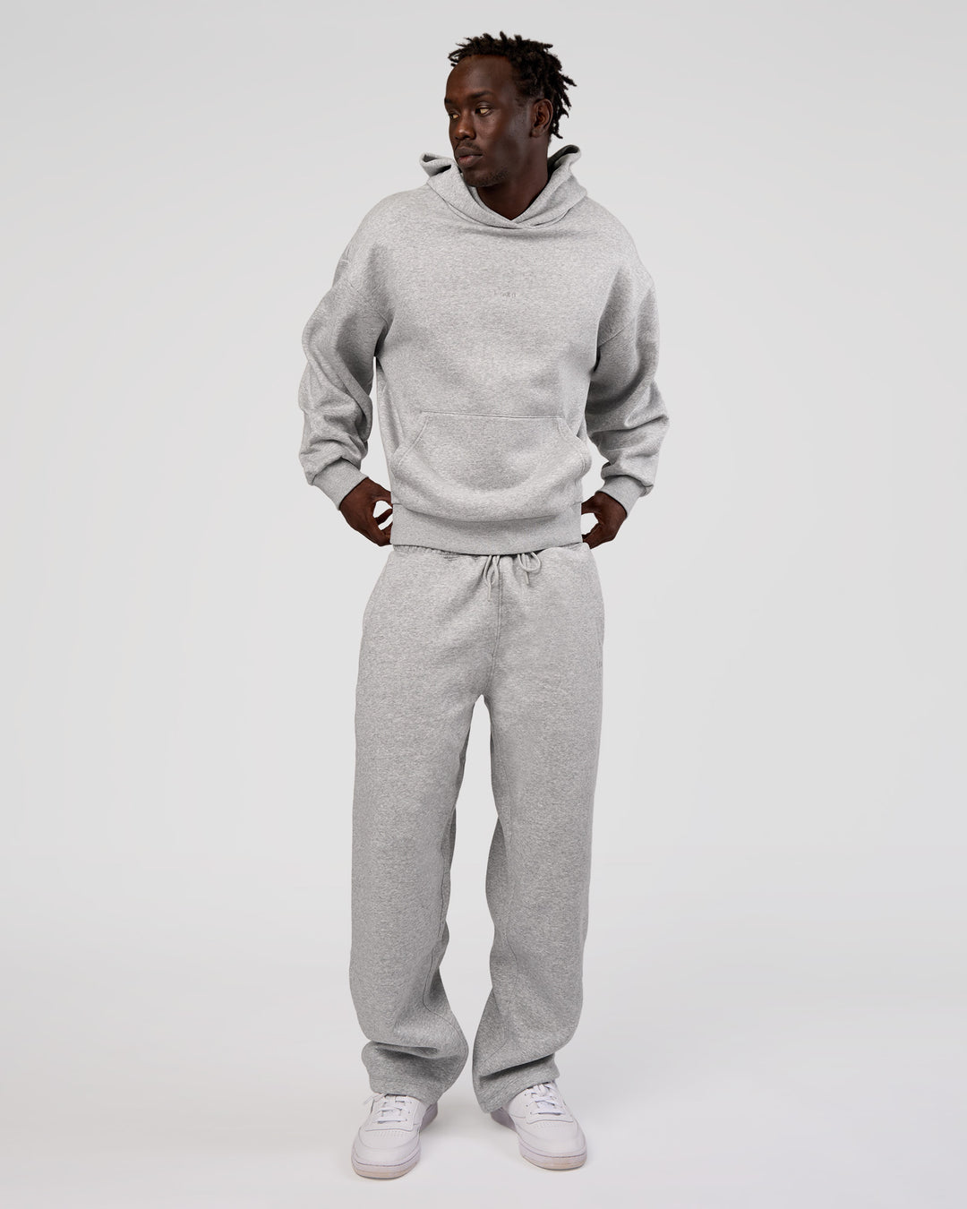 Man wearing MVP Straight Leg Pant - Light Grey Marl | Model:Okello | Size:M