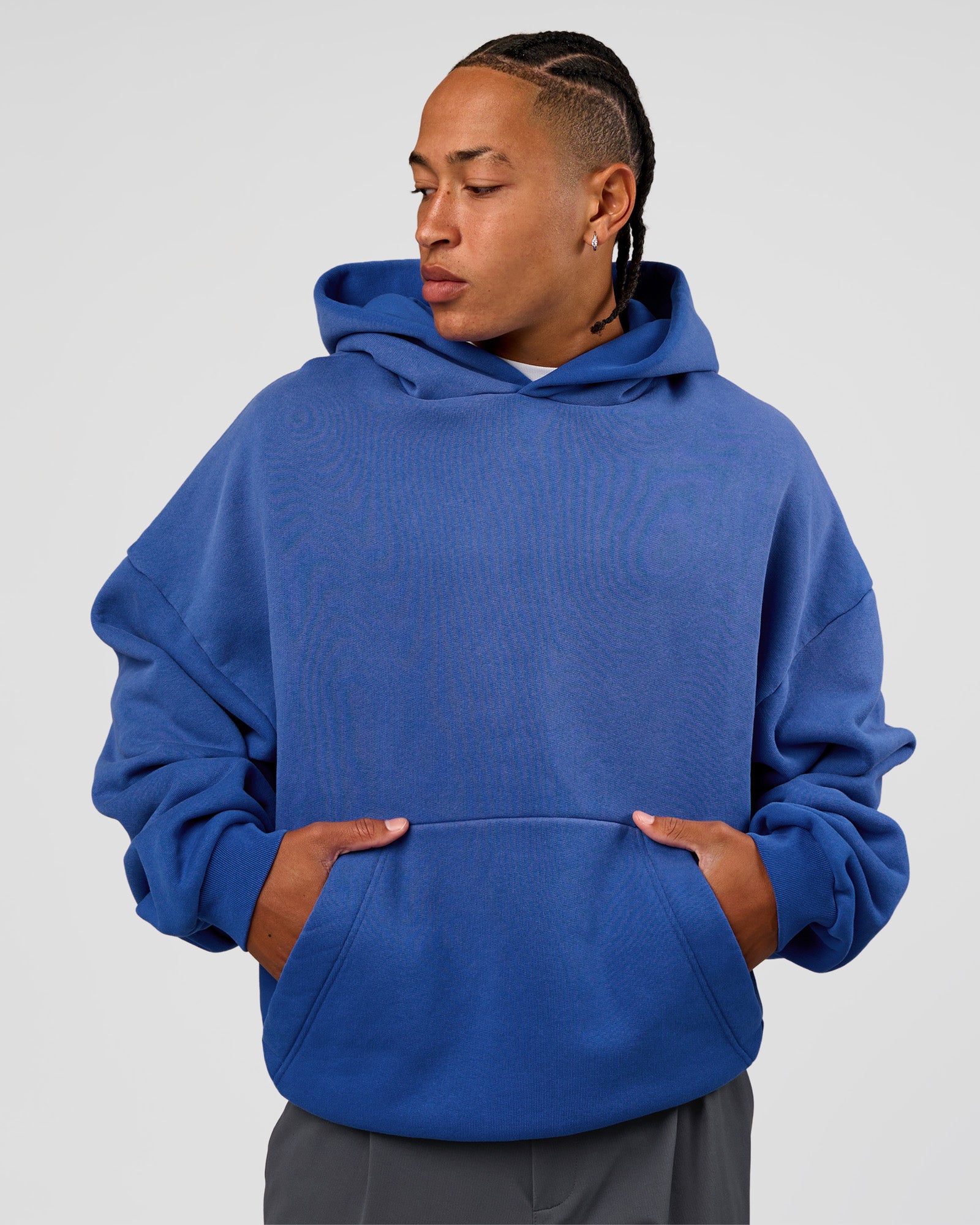 Man wearing Memory In Motion Ultra Heavyweight Washed Hoodie - Electric Indigo Washed | Model:Malebo | Size:M