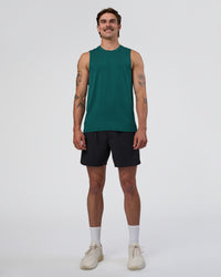 Man wearing AeroFLX+ Seamless Muscle Tank - Transformative Teal/Transformative Teal | Model:Konnor | Size:M