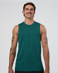 Man wearing AeroFLX+ Seamless Muscle Tank - Transformative Teal/Transformative Teal | Model:Konnor | Size:M