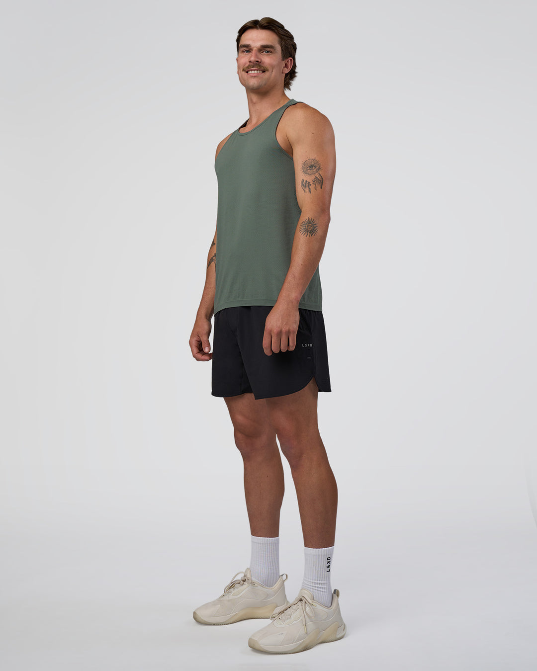 Man wearing AeroFLX+ Seamless Tank - Graphite/Graphite | Model:Konnor | Size:M