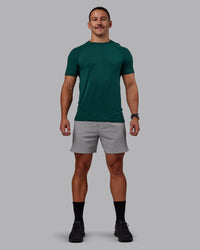 Man wearing AeroFLX+ Seamless Tee - Dark Moss/Dark Moss | Model:Jaiden | Size:M