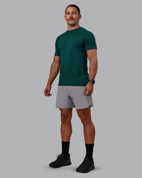 Man wearing AeroFLX+ Seamless Tee - Dark Moss/Dark Moss | Model:Jaiden | Size:M