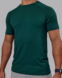 Man wearing AeroFLX+ Seamless Tee - Dark Moss/Dark Moss | Model:Jaiden | Size:M