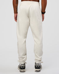 Man wearing MVP Cuffed Track Pant - Silver Marl | Model:Malebo | Size:M