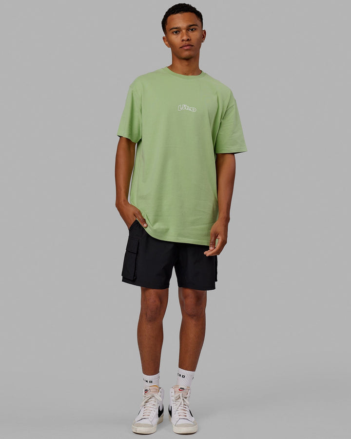 Man wearing Mad Happy Heavyweight Longline Tee Oversize - Green Fig