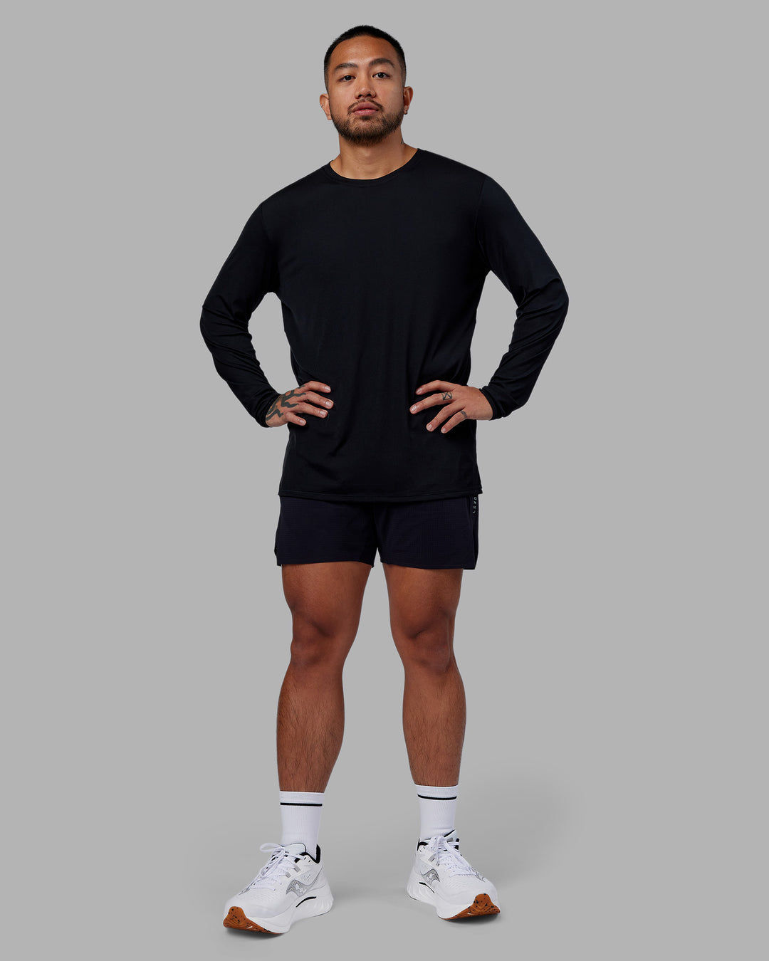 Man wearing Pace Running Long Sleeve Top - Black | Model:Justin | Size:M