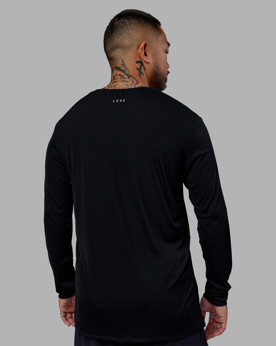 Man wearing Pace Running Long Sleeve Top - Black | Model:Justin | Size:M
