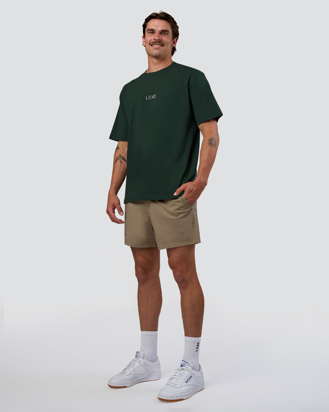 Man wearing Merry Journey FLXCotton Oversized Tee - Vital Green-White | Model:Konnor | Size:M
