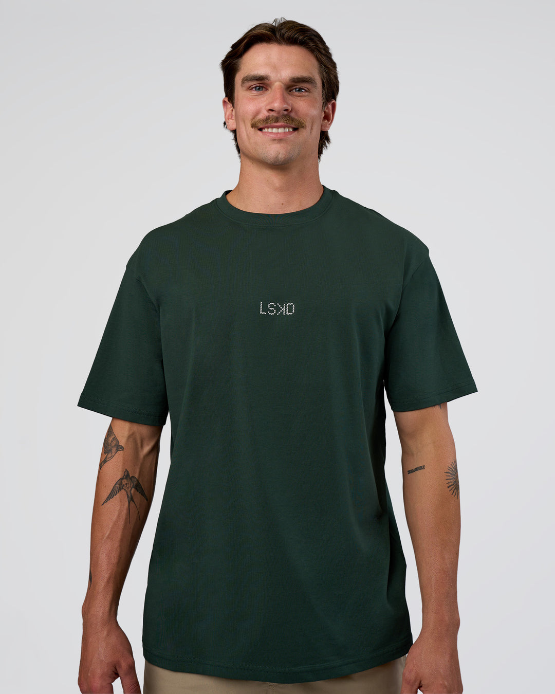 Man wearing Merry Journey FLXCotton Oversized Tee - Vital Green-White | Model:Konnor | Size:M