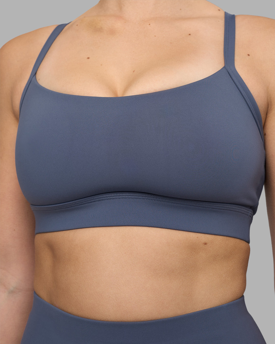 Woman wearing Momentum Sports Bra D/DD/E - Night Shadow | Model:Amy | Size:M