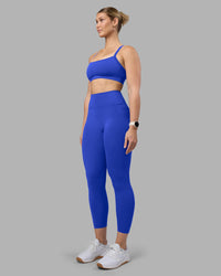 Woman wearing Momentum Sports Bra - Power Cobalt | Model:Amy | Size:M