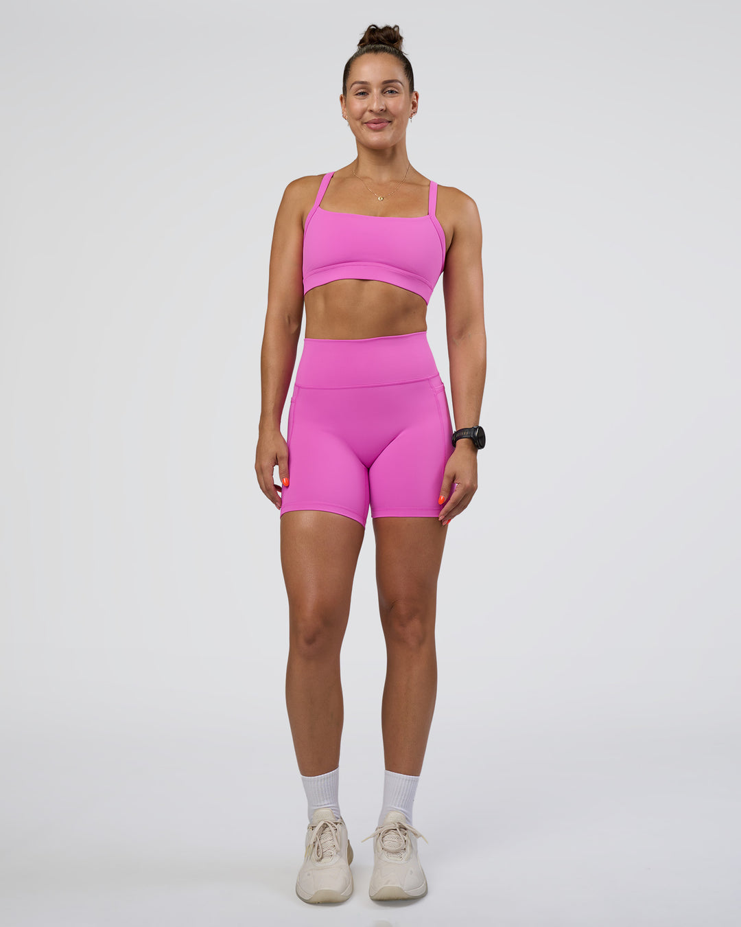 Woman wearing Momentum Sports Bra - Ultra Fuchsia | Model:Abbey | Size:M