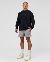 Man wearing Move Fast Heavyweight Oversized Long Sleeve Tee - Black Washed | Model:Jaiden | Size:M