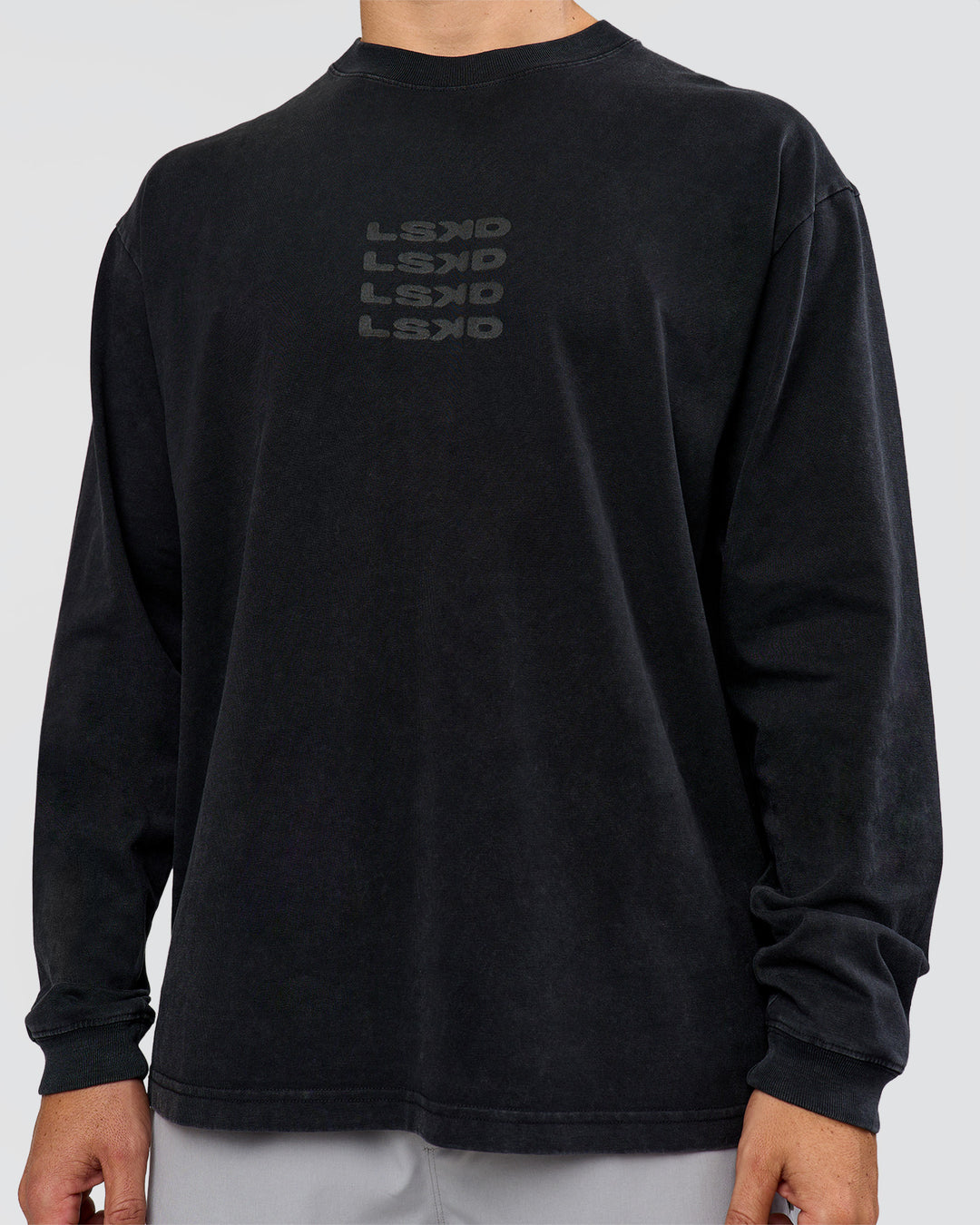 Man wearing Move Fast Heavyweight Oversized Long Sleeve Tee - Black Washed | Model:Jaiden | Size:M