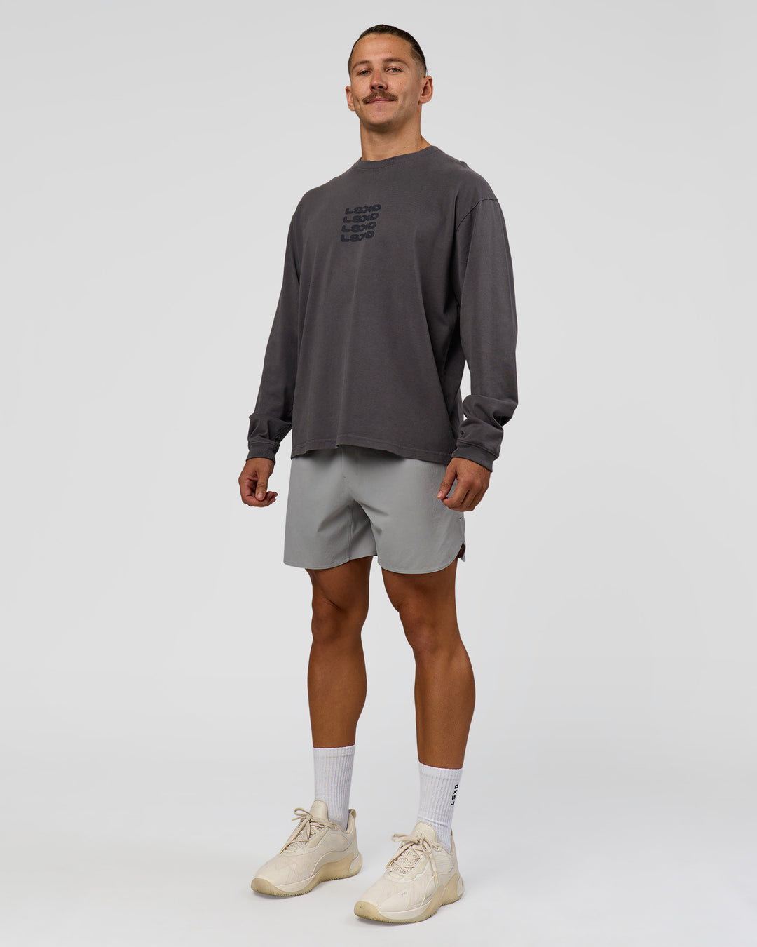 Man wearing Move Fast Heavyweight Oversized Long Sleeve Tee - Dark Storm Washed | Model:Jaiden | Size:M
