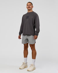 Man wearing Move Fast Heavyweight Oversized Long Sleeve Tee - Dark Storm Washed | Model:Jaiden | Size:M