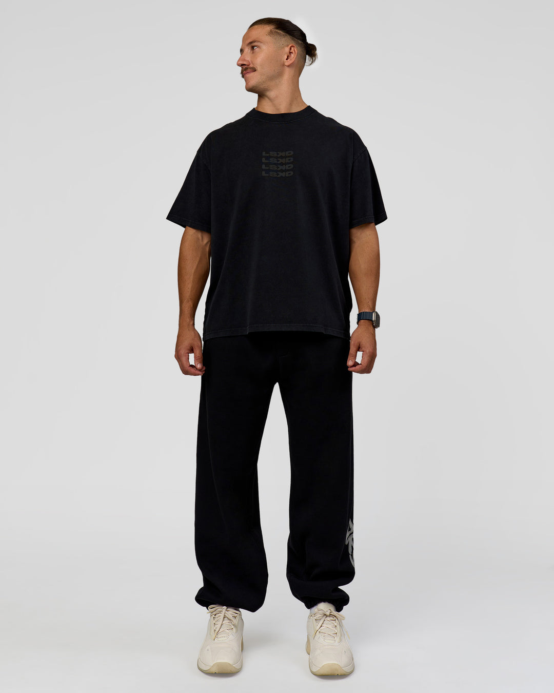Man wearing Move Fast Heavyweight Oversized Tee - Black Washed | Model:Jaiden | Size:M