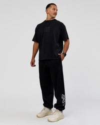 Man wearing Move Fast Heavyweight Oversized Tee - Black Washed | Model:Jaiden | Size:M