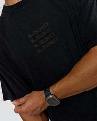 Man wearing Move Fast Heavyweight Oversized Tee - Black Washed | Model:Jaiden | Size:M