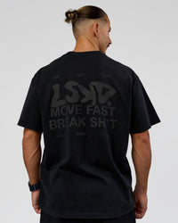 Man wearing Move Fast Heavyweight Oversized Tee - Black Washed | Model:Jaiden | Size:M