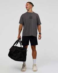 Man wearing Move Fast Heavyweight Oversized Tee - Dark Storm Washed | Model:Jaiden | Size:M