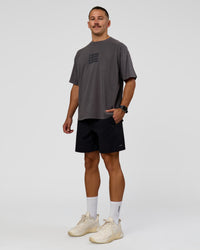 Man wearing Move Fast Heavyweight Oversized Tee - Dark Storm Washed | Model:Jaiden | Size:M