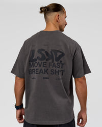 Man wearing Move Fast Heavyweight Oversized Tee - Dark Storm Washed | Model:Jaiden | Size:M