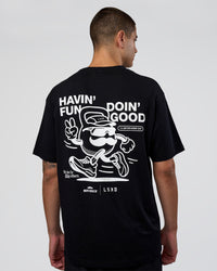 Man wearing Movember 2025 FLXCotton Oversize Tee - Black | Model:Zoran | Size:M
