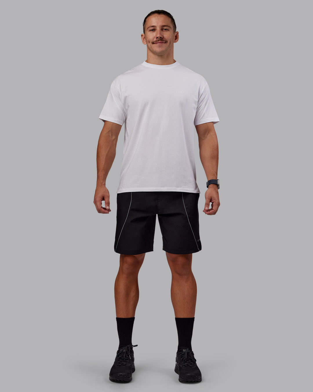Man wearing Nocturnal 8” Short - Black | Model:Jaiden | Size:M