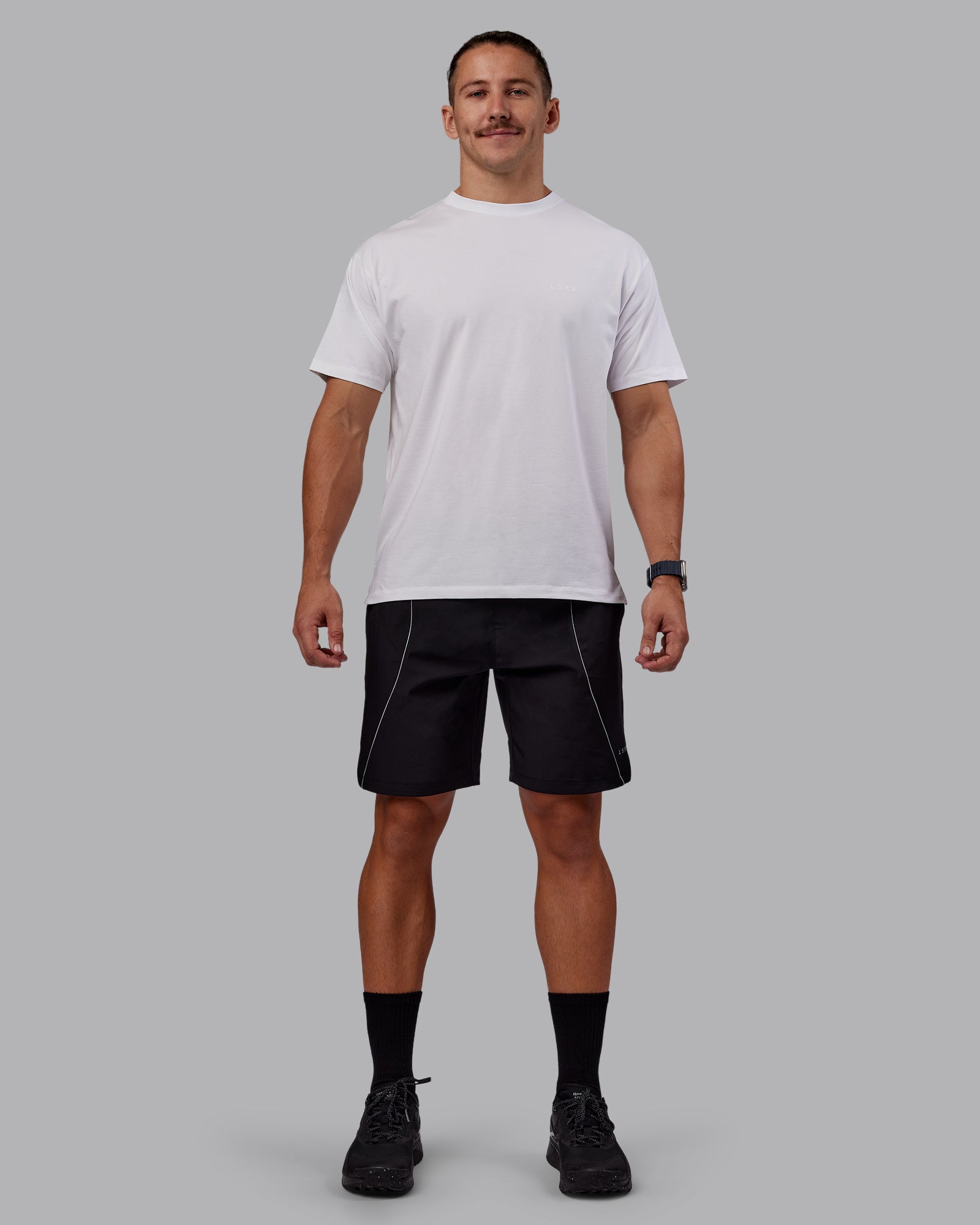 Man wearing Nocturnal 8” Short - Black | Model:Jaiden | Size:M
